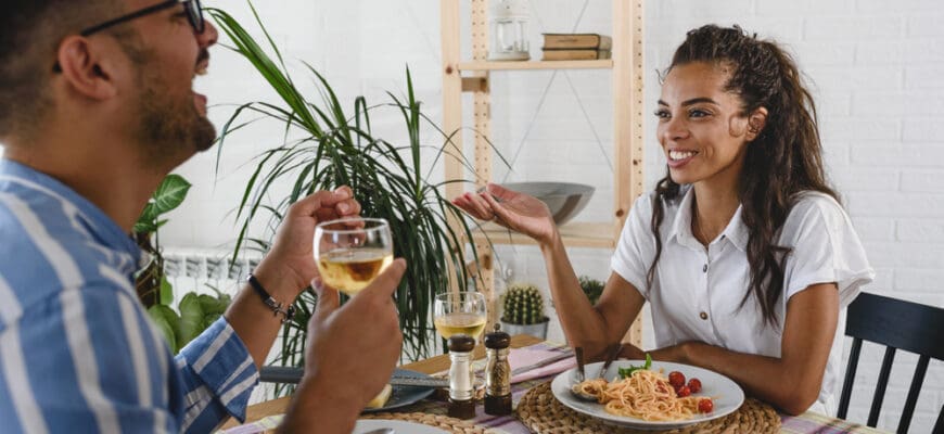 Young,Cheerful,Multi-ethnic,Couple,Eating,Pasta,,Drinking,Vine,Having,Lunch